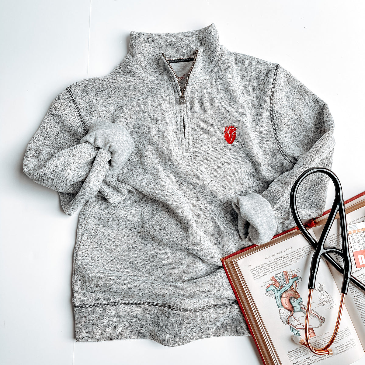 Sweatshirt pullover with embroidered cardiac anatomy heart